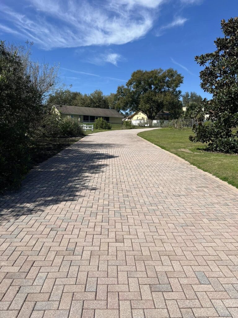 Paver Sealing 5 a brick paver path with trees and grass