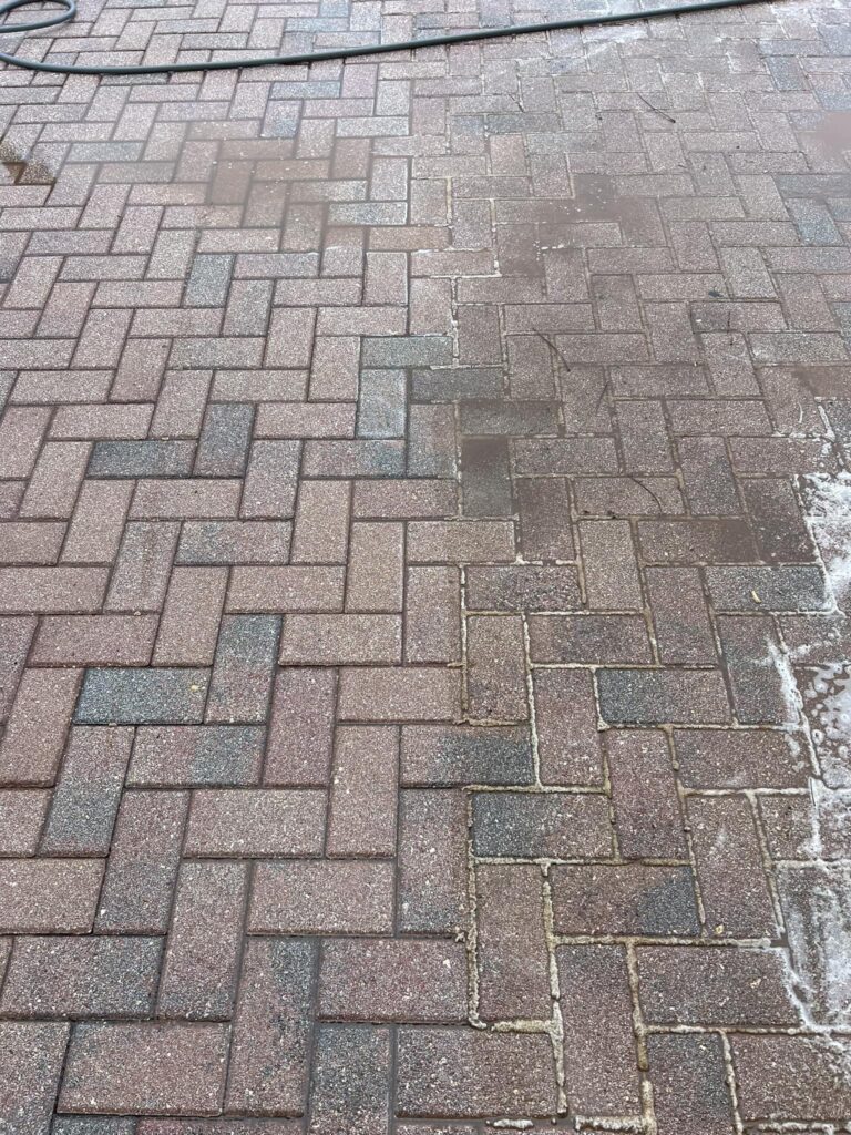 Paver Sealing in Lakeland 5 a brick sidewalk with water on it. The best paver sealing in Central Florida. pressure Washing services in Lake Wales. Paver sealing in Lakeland