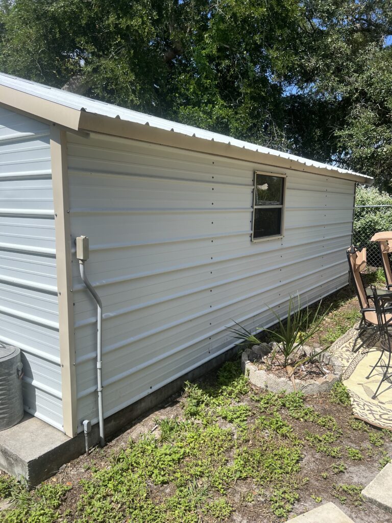 a shed with chairs and a table. The best house washing in Winter Haven